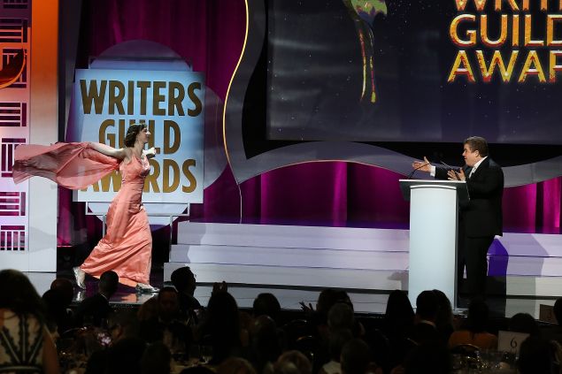 Kristen Schaal runs to West Coast host Patton Oswalt during the 2016 Writers Guild Awards.