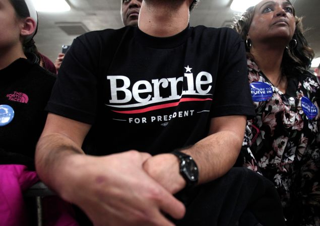 People listen to Democratic presidential candidate, U.S. Sen. Bernie Sanders speak at a campaign rally at United Auto Workers Union Local 600 February 15 in Dearborn, Michigan.