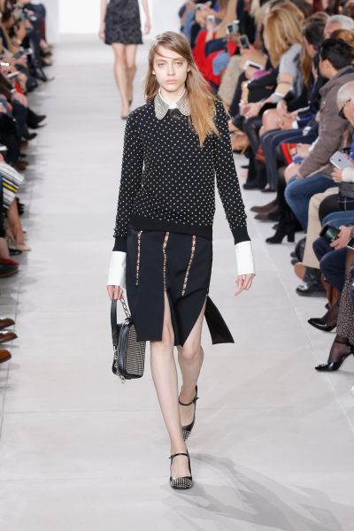 Studded Cashmere Sweater, $1,295, Julie Small Studded Leather Camera Bag, $1,550, and Bess Studded-Leather Pump, $895, All at Michaelkors.com