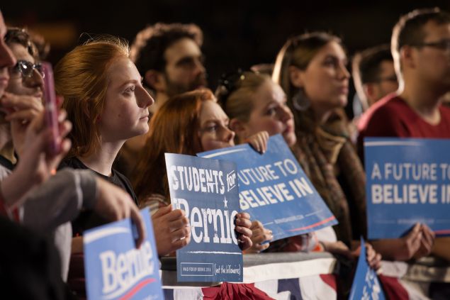 Attendees listen as democratic presidential candidate, Sen. Bernie Sanders (D-VT) speaks at a rally on February 22, 2016 at the University of Massachusetts in Amherst, Massachusetts. Sanders is campaigning in the lead up to Super Tuesday primaries on March 1 when 11 states will vote.