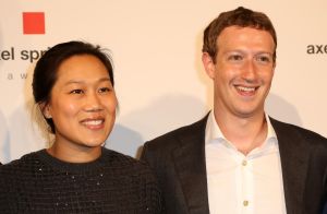 Mr. Zuckerberg (right) and his wife, Priscilla Chan.