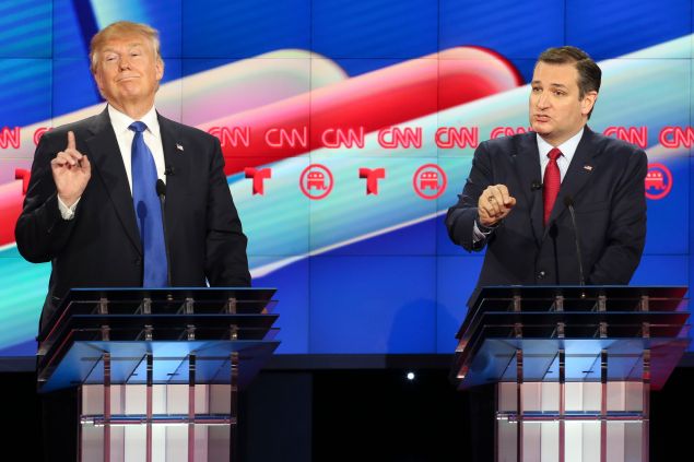 Donald Trump waits to answer a question as Ted Cruz talks during the Republican Presidential Primary Debate at the University of Houston Thursday, Feb. 25, 2016.