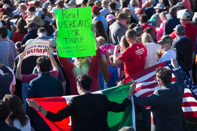 MADISON, AL - FEBRUARY 28: Demonstrators are confronted by a supporter of Republican presidential candidate Donald Trump during a campaign rally at the Madison City Schools Stadium on February 28, 2016 in Madison, Alabama. Trump is in Alabama ahead of the Super Tuesday primaries March 1. (Photo by Scott Olson/Getty Images)