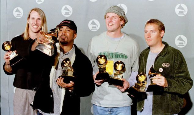 Hootie and the Blowfish pose for photographers with their Grammy for Best New Artist and Best Pop Performance by a Group with Vocal for "Let Her Cry" at the 38th Annual Grammy Awards in Los Angeles, February 28, 1996.