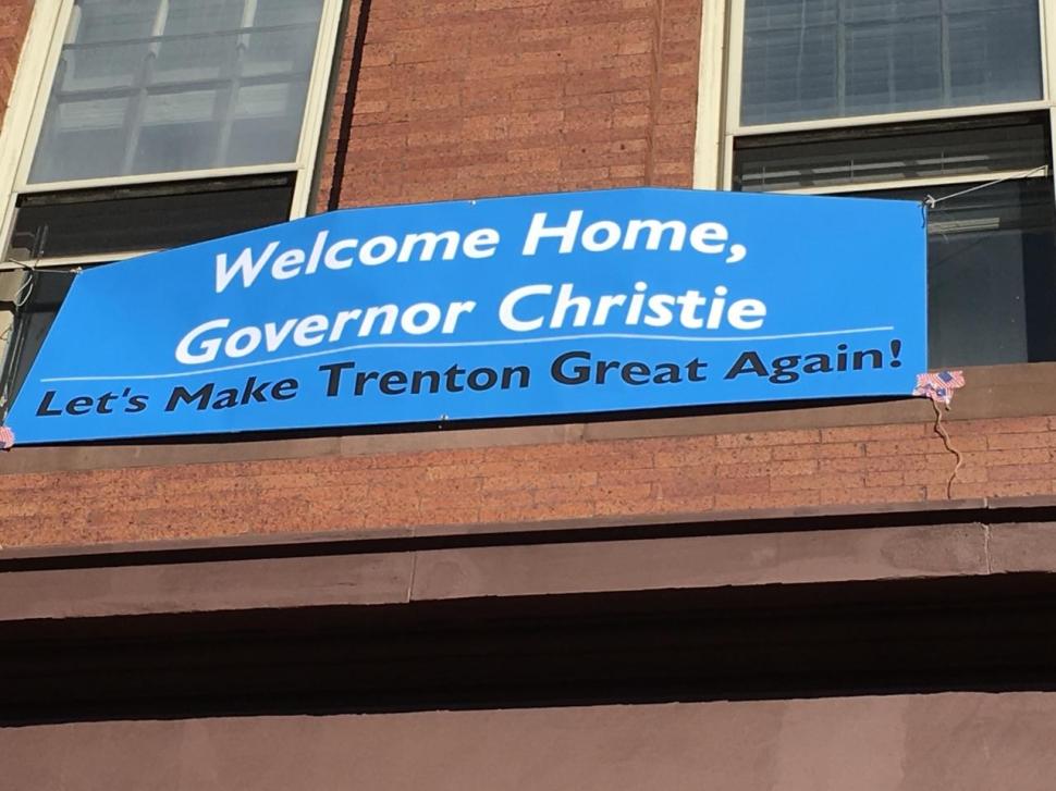 A banner in Trenton unfurled outside the office of Assemblyman Reed Gusciora (D-15).