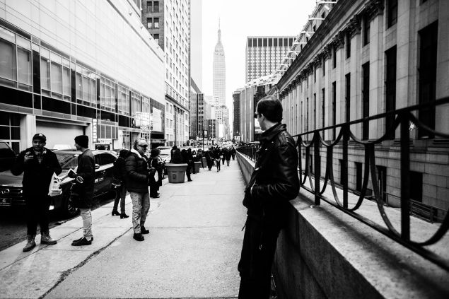 A male model musing outside of NYFW