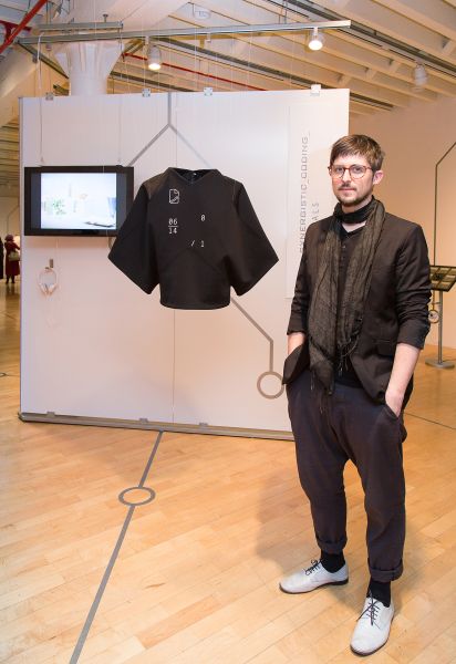 Cedric Flazinski standing next to his project "NORMALS" at the Coded_Couture Exhibition Opening at Pratt Manhattan Gallery on 11 Febuary, 2016.