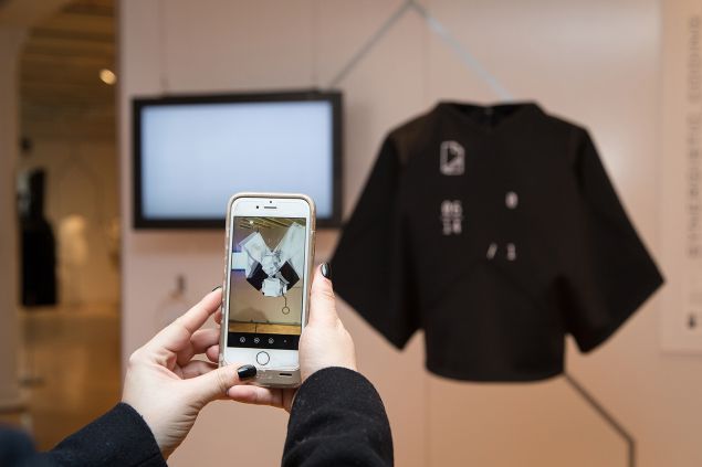 Guest uses Normals Apparel app in conjunction with "NORMALS" at the Coded_Couture Exhibition Opening at Pratt Manhattan Gallery on 11 Febuary, 2016.