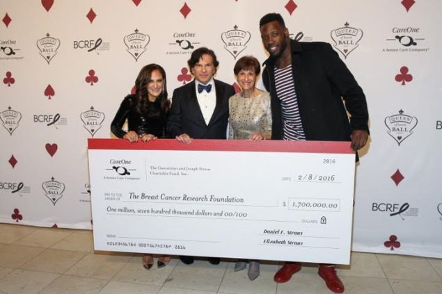 Elizabeth Straus, Daniel E. Straus, Myra Biblowit, and Jason Pierre-Paul pose with $1.7 million check at CareOne's Queen of Hearts Ball and Casino Night at Guastavino's, on Tuesday, Feb. 9, 2016 in New York. (Photo by Mark Von Holden/AP Images for CareOne Management LLC)