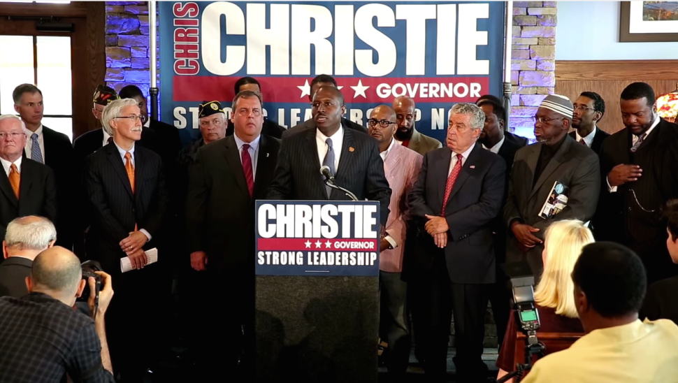 Dwayne Warren stood with Gov. Christie in the latter's re-election campaign as a leader of Democrats for Christie. (Youtube)