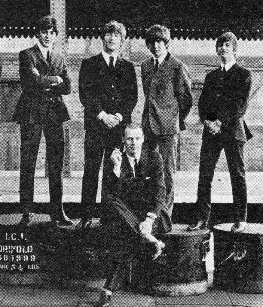 George Martin and the Beatles.