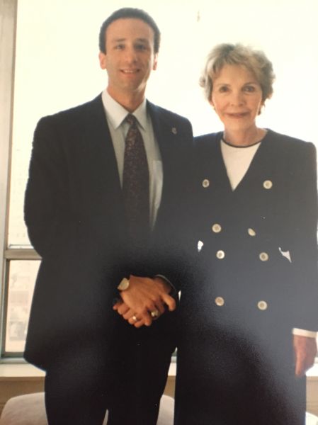 Author Scott Alswang of the USSS shakes hands with Nancy Reagan, who he occasionally protected in New York.