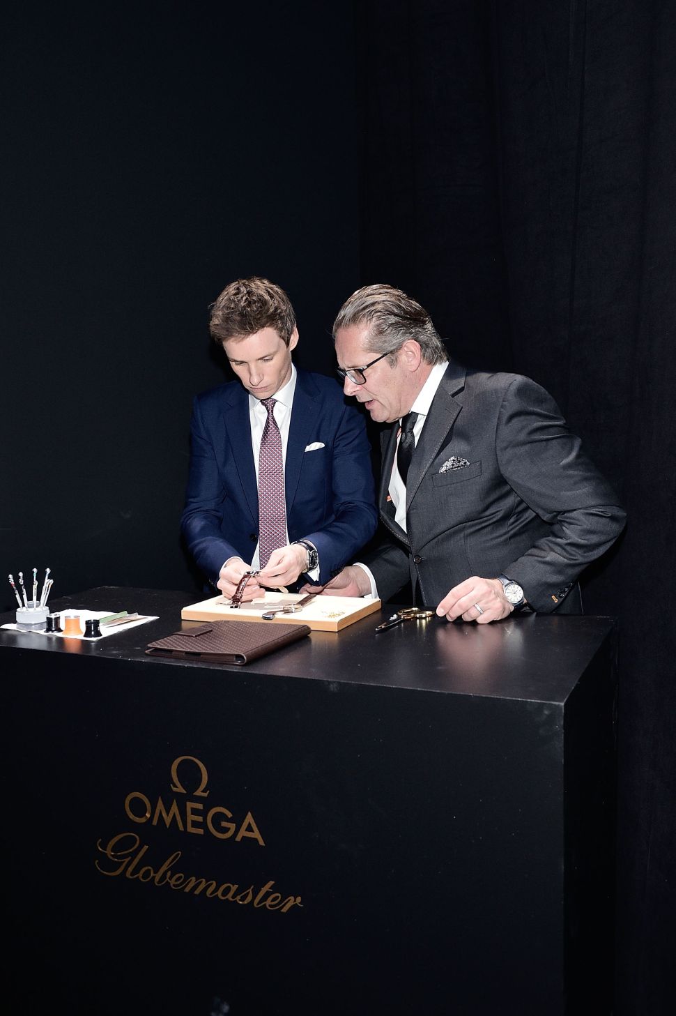 Eddie Redmayne, OMEGA vice president product and costumer service Jean-Claude Monachon