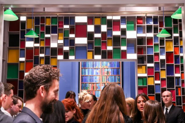 Colorful notebooks line a back wall