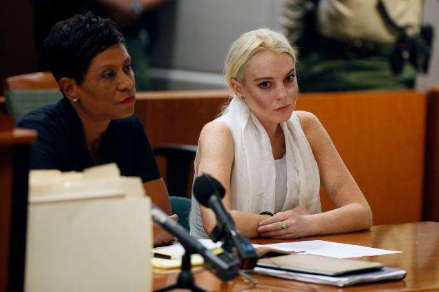 LOS ANGELES, CA - OCTOBER 19: Lindsay Lohan attends her probation progress report hearing with her lawyer Shawn Chapman Holley at (L) the Airport Courthouse on October 19, 2011 in Los Angeles, California. Judge Stephanie Sautner suspended Lohan's probation and bail has been set at USD 100,0000 after Lohan was terminated by the Downtown Women's Center for repeatedly failing to appear for community service. If Lohan posts bail she has been ordered to community service for 16 hours per week at the L.A. County coroner's office until her next court date on November 2. Lohan has been sentenced to a total of 480 hours of community service stemming from a 2007 drunk-driving conviction and a jewelry theft conviction earlier this year.