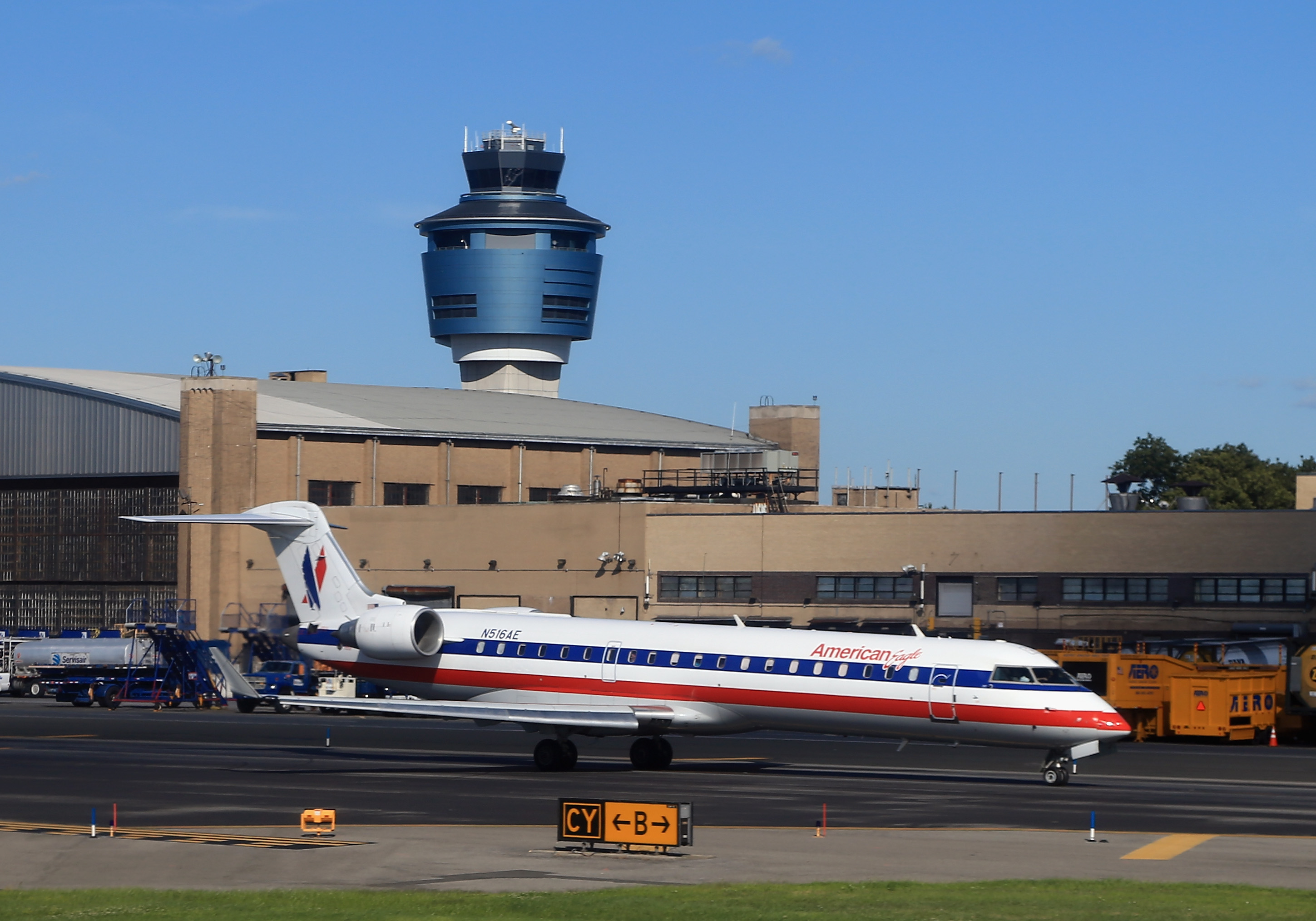 An American Airlines jet taxis on the runway at Laguardia Airport on August 14, 2013 in New York, New York.