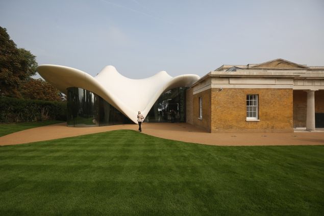 LONDON, ENGLAND - SEPTEMBER 25: Members of the public admire the redeveloped Serpentine Sackler Gallery in Hyde Park on September 25, 2013 in London, England. The renovation of the 1805 gunpowder store, located on the north side of the Serpentine Bridge, was designed by Zaha Hadid Architects. The new gallery, restaurant and social space will officially open to the public on September 28, 2013.