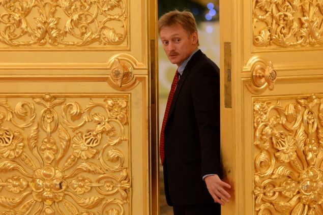 Vladimir Putin's spokesman Dmitry Peskov attends a meeting in the Kremlin in Moscow, on December 25, 2013.