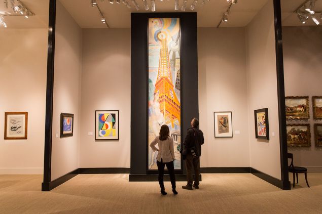 LONDON, ENGLAND - JUNE 23: Visitors to the Masterpiece Fair look at a four metre tall painting by Robert Delaunay on June 23, 2015 in London, England. The Masterpiece Fair will be held at Royal Hospital Chelsea from June 25 - July 1 and features 150 dealers of art, antiques and design. 
