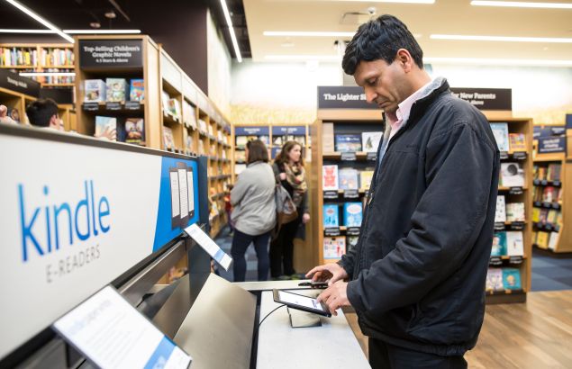 A customer Seattle uses a Kindle table device at the an Amazon facility last November.