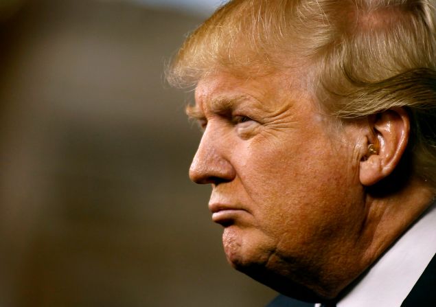Republican presidential candidate Donald Trump peers out into the crowd during a campaign event at the International Air Response facility on December 16, 2015 in Mesa, Arizona.