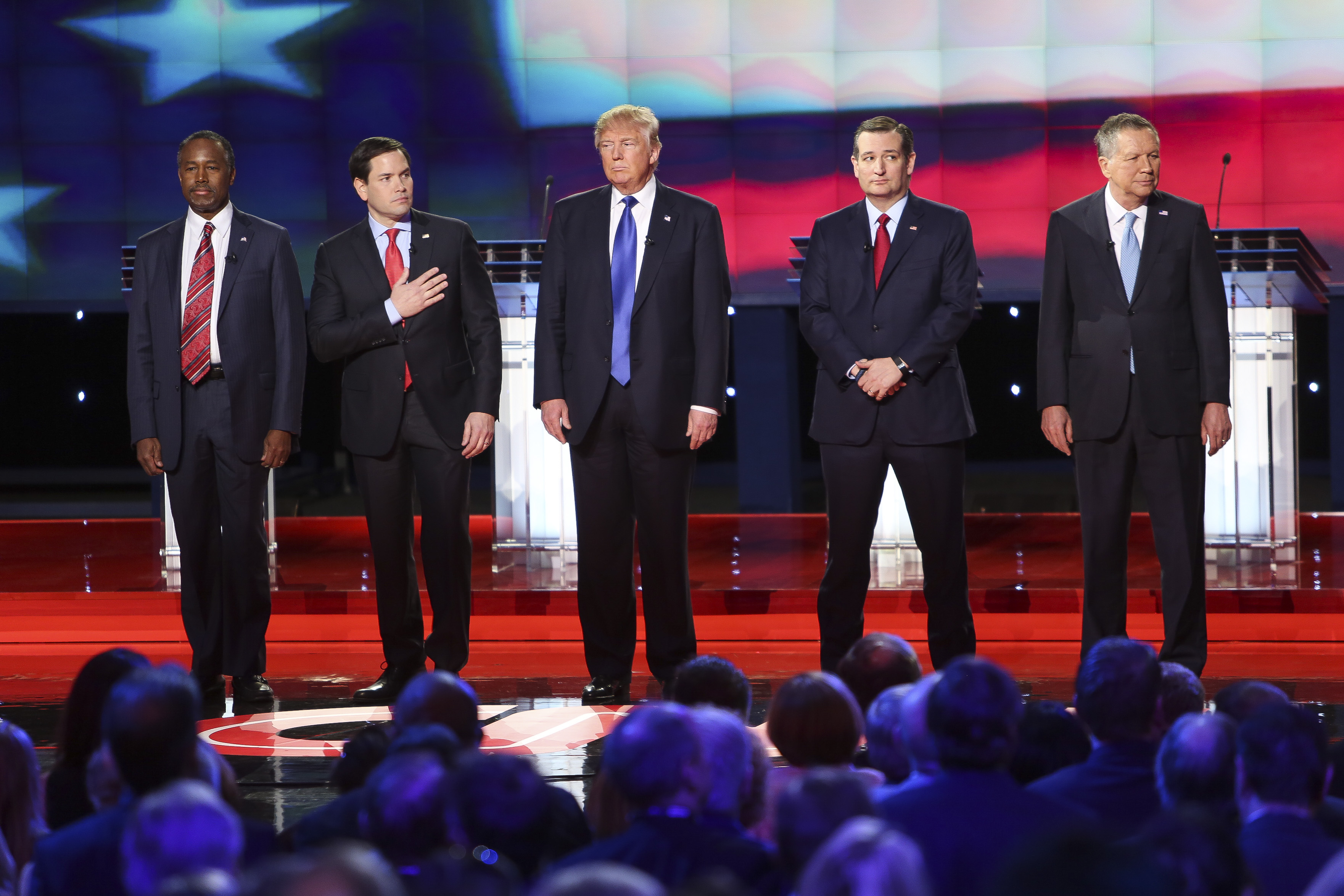 Presidential candidates Marco Rubio, Donald Trump, Ted Cruz and John Kasich and former candidate Ben Carson stand for the national anthem during the Republican Presidential Primary Debate at the University of Houston Thursday, Feb. 25, 2016.