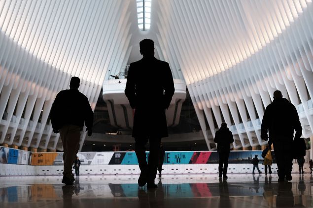 Commuters walk through the Oculus of the partially opened World Trade Center Transportation Hub after nearly 12 years of construction on March 7, 2016 in New York City.