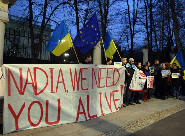 People attend a demonstration in front of Russian embassy in Warsaw in support of Ukrainian pilot Nadiya Savchenko on March 9, 2016. The 34-year-old Iraq war veteran faces up to 23 years in prison if convicted in a case that has drawn global attention and been attended by Western monitors concerned about Russia's record on human rights.