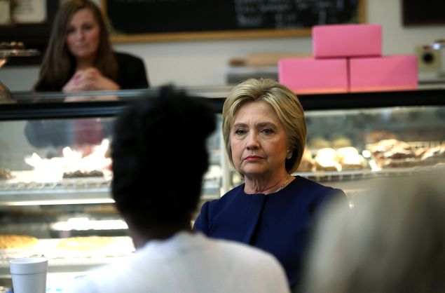 Democratic presidential candidate former Secretary of State Hillary Clinton speaks with local residents at 8 Sisters Bakery on March 13, 2016 in Marion, Ohio. Hillary Clinton is campaigning in Ohio ahead of Tuesday's primary.