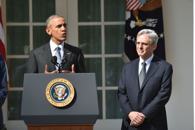 US President Barack Obama announces his Supreme Court nominee, Merrick Garland (R), in the Rose Garden at the White House in Washington, DC, on March 16, 2016. Garland, 63, is currently Chief Judge of the United States Court of Appeals for the District of Columbia Circuit. The nomination sets the stage for an election-year showdown with Republicans who have made it clear they have no intention of holding hearings to vet any Supreme Court nominee put forward by the president.