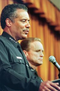 Former LAPD Chief of Police Bernard C. Parks (L) at a 1999 press conference.