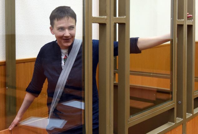 Ukrainian military pilot Nadiya Savchenko looks out from a defendants' cage after the first day of the verdict announcement at a court in the southern Russian town of Donetsk, on March 21, 2016. A Russian court on March 21 began delivering its verdict in the high-profile murder trial of Ukrainian helicopter pilot Nadiya Savchenko, which Kiev and the West have slammed as a political sham. Prosecutors are demanding a 23-year jail term for Savchenko's alleged involvement in the killing of two Russian state TV journalists in war-torn eastern Ukraine in 2014.