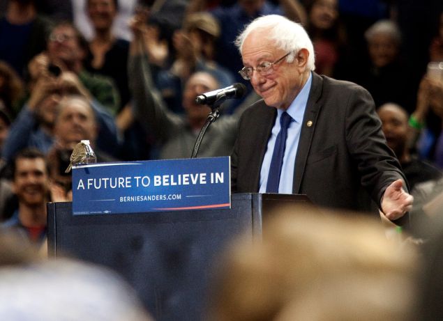 A bird lands on Bernie Sanders's podium as he speaks on Portland, Oregon Friday March 25, 2016. Sanders spoke to a crowd of more than eleven thousand about a wide range of issues, including getting big money out of politics, his plan to make public colleges and universities tuition-free, combating climate change and ensuring universal health care.