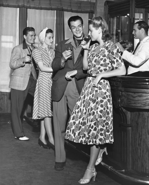 UNITED STATES - CIRCA 1950s: Socializing at a bar. 