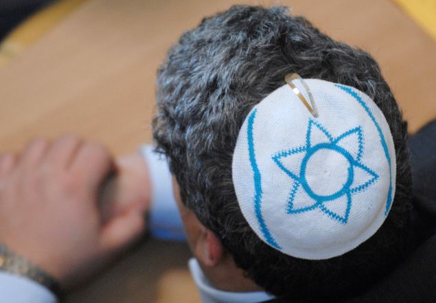 A member of the Jewish community, wearing a kippa.