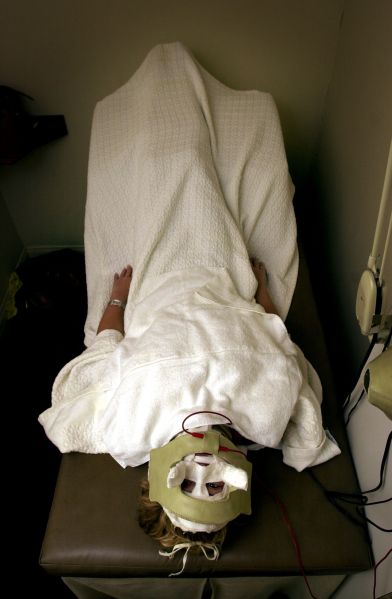 386657 02: Lara Shriftman receives Galvanic currents behind a mask in the final step of a facial treatment at the Face Place March 13, 2000 in Hollywood, CA. It is one of the ways some celebrities are preparing their appearances for the upcoming Oscar Awards presentatons.