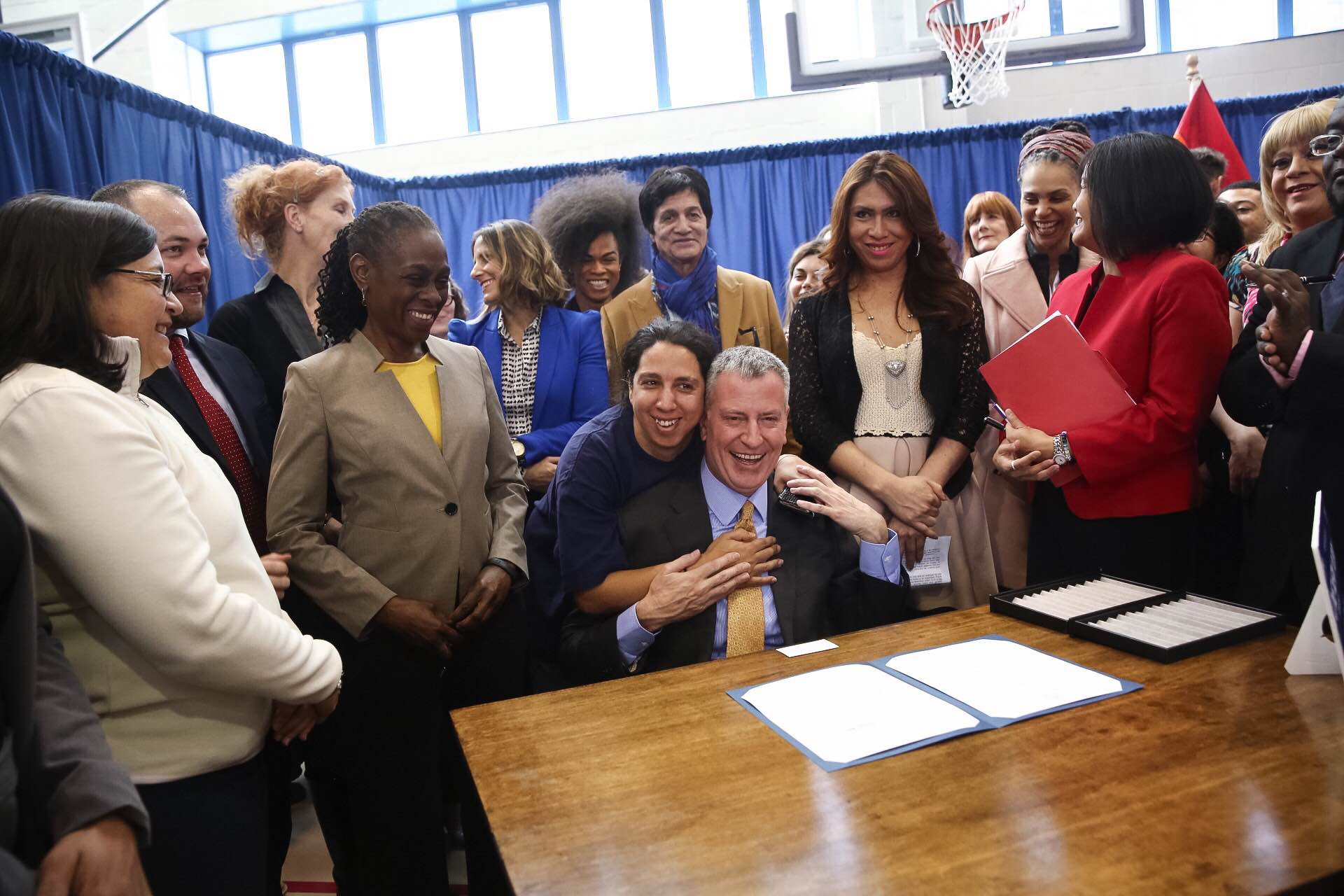 Mayor Bill de Blasio signs the executive order in Chelsea today.