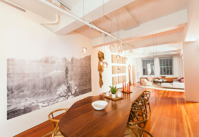 The dining room with a custom table designed by Bade Stageberg Cox, works by Amalia Pica, Danh Vo and Fred Sandback.