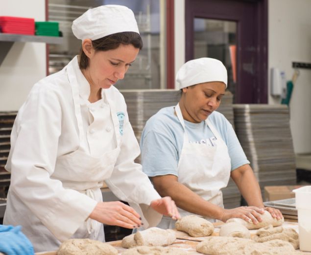 Jessamyn Waldman Rodriguez, left, with a Hot Bread Kitchen fellow.