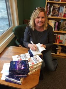 Marie Force signing her books.