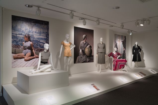 Overview of gallery featuring a Claire McCardell swimsuit, Carolyn Schnurer play suit, Mainbocher suit, Claire McCardell dress, and Christian Dior New York coat, collection of The Museum at FIT.