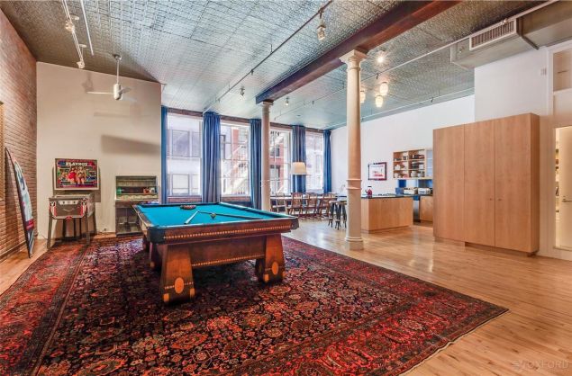 Full game room going on here with the pool table, pinball machine and jukebox.