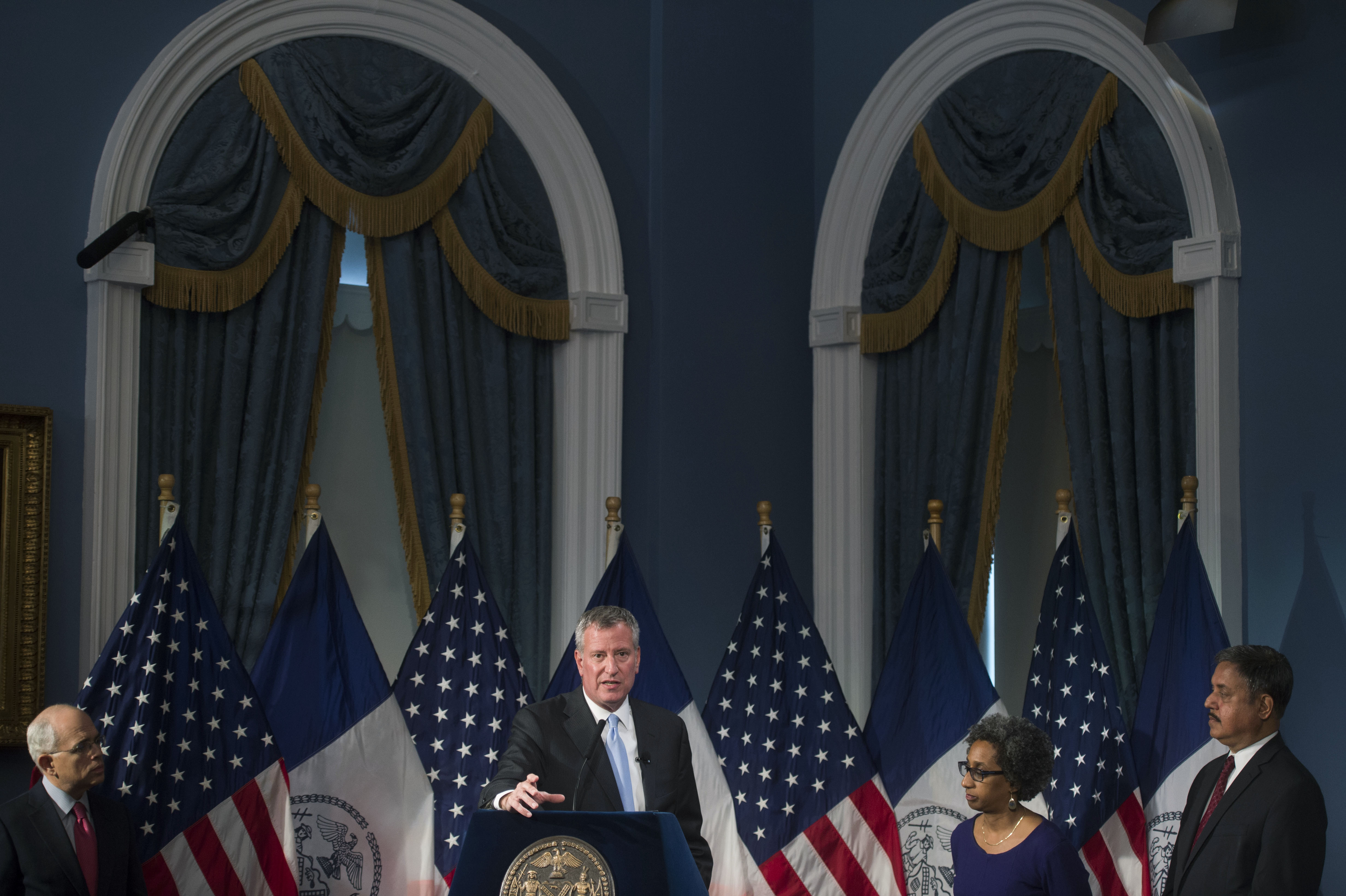 Mayor Bill de Blasio, center, speaks about the budget of the city's public hospitals.