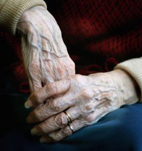 LONDON - APRIL 04: A 90 year old Pensioners clasps her hands together during a group exercise in a day care centre on April 4, 2006 in London England. The State Pension Commission today defended it's proposal of an age rise for when the pension can be taken, from 65 to 68 by the year 2050. (Photo by Daniel Berehulak/Getty Images)