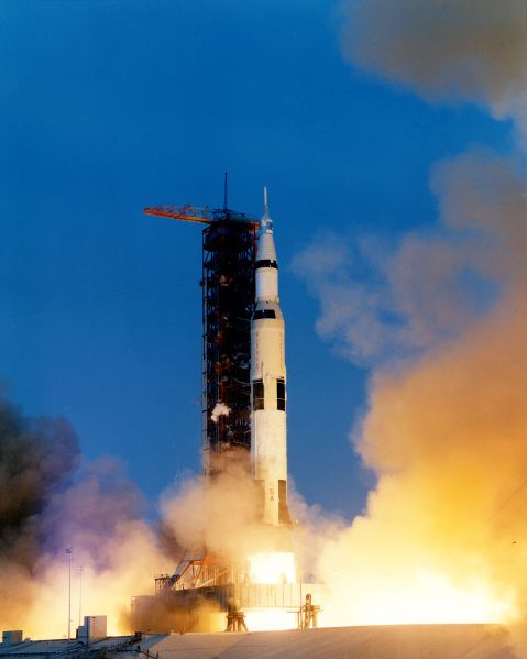 Apollo 13 lifts off. 