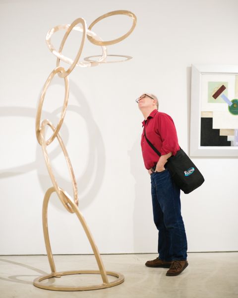 A guest underneath one of Mr. Carter's towering creations.