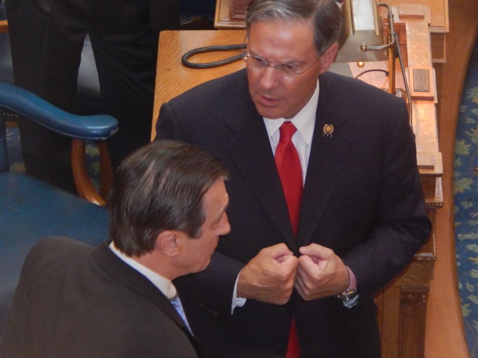 Assembly Minority Leader Jon Bramnick (R-21) finds Assemblyman John Burzichelli (D-3) on the floor of the Assembly Chamber after the Dems' marathon caucus session earlier this summer.