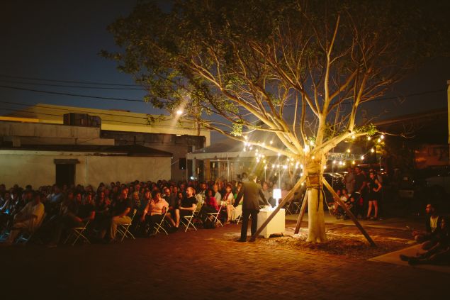 Verse is light at night in this scene from the "O, Miami" poetry festival.