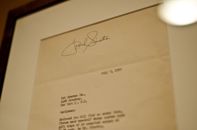 The flagship's walls are lined with memorabilia—from letters signed by Frank Sinatra to snapshots of Nat Sherman himself.