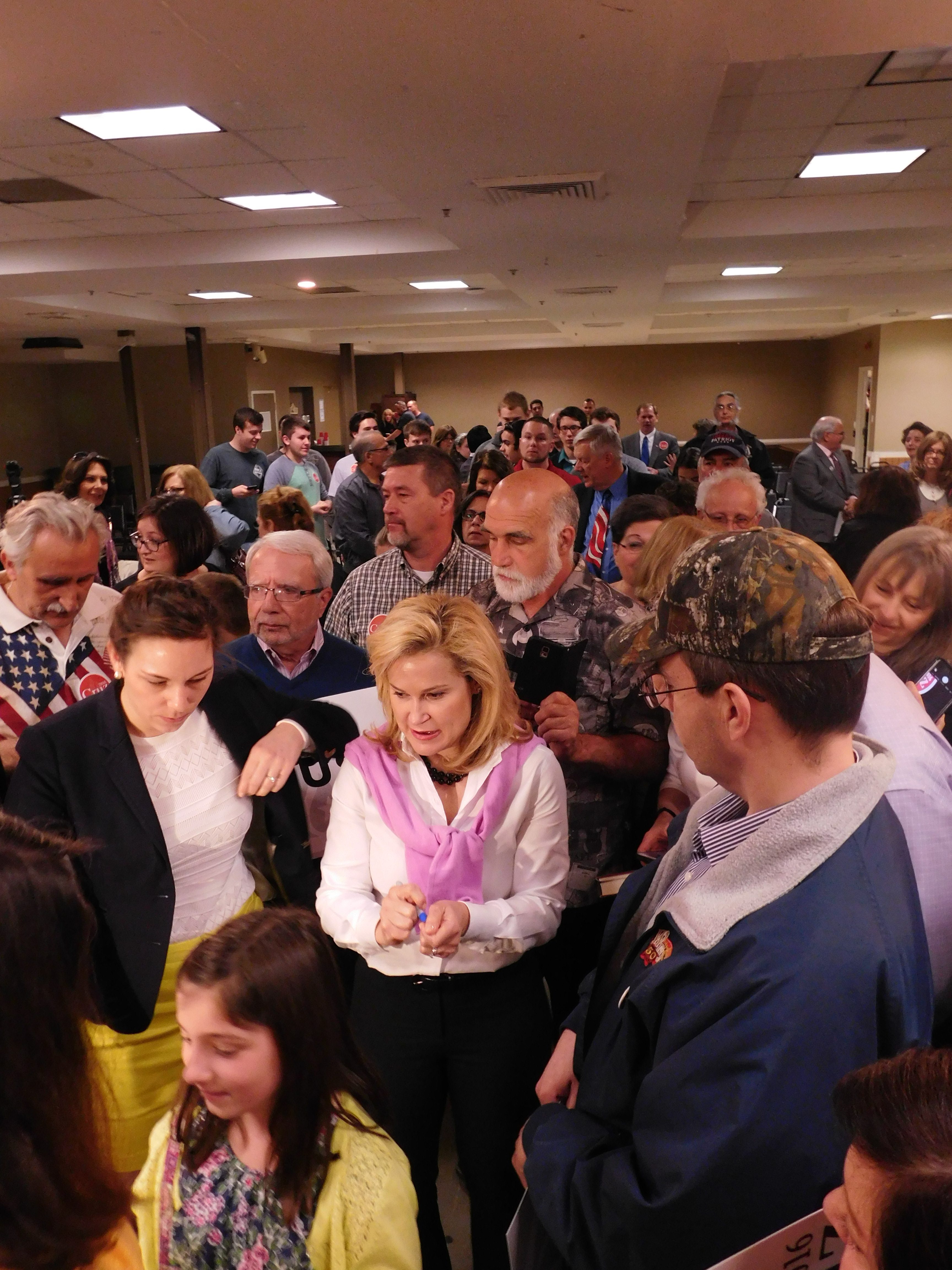 Cruz (center) with supporters in Wayne.